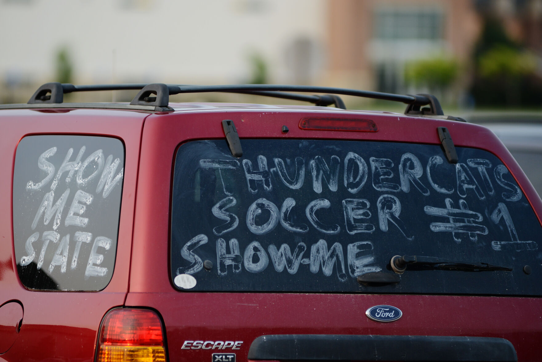 A decorated car sits in the parking lot